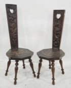 Two spinning chairs with carved back splats, octagonal seats, carved foliate decoration, on turned