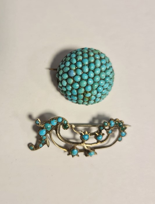Gold-coloured and turquoise circular brooch with turquoise beads inset and another gold-coloured and