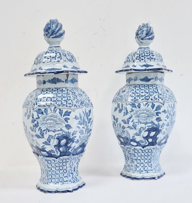 Pair of 18th century Dutch Delft vases with covers of hexagonal baluster form, the domed covers with