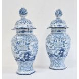 Pair of 18th century Dutch Delft vases with covers of hexagonal baluster form, the domed covers with