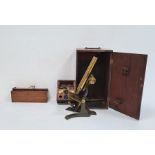 Metal and brass microscope in wooden box and a bone and ivory nine-spot domino set in 19th century