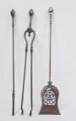 Set of three steel fire tools to include a poker, tongs and shovel with pierced fretwork