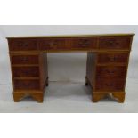 20th century pedestal desk with green leather inset top, moulded edge above eight assorted
