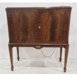 20th century mahogany cocktail cabinet, the rectangular top with moulded edge above two cupboard