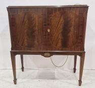 20th century mahogany cocktail cabinet, the rectangular top with moulded edge above two cupboard