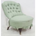 19th century chair in pale green upholstery, turned and ring front legs to brass caps and castors