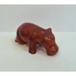 Carved amber-coloured miniature model of a hippopotamus, 5cm wide