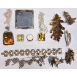 Quantity of costume jewellery to include silver charm bracelets, compacts, silver and