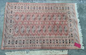 Persian style rug in pink , elephant guls in blue and red border; measurements 147cm x 95cm