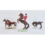Beswick pottery glazed huntsman on horseback and two pottery model horses with brown glaze (3)