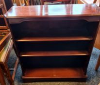 Modern mahogany and banded open bookcase on bracket feet, 74.5cm x 85cm