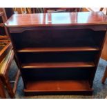 Modern mahogany and banded open bookcase on bracket feet, 74.5cm x 85cm