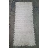 Cream ground rug with striped decoration and another rug (2)