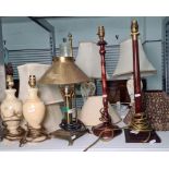 Various table lamps to include two wooden table lamps, brass paraffin lamp converted to