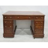 Late 19th century mahogany pedestal desk with red leatherette inset top, nine assorted drawers,