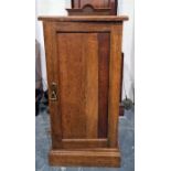 Early 20th century Arts & Crafts-style single door oak pot cupboard, the square top with moulded