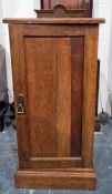 Early 20th century Arts & Crafts-style single door oak pot cupboard, the square top with moulded