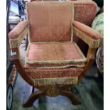 Early 20th century oak framed chair by Parker Knoll in pink ground patterned upholstery, curved x-