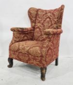 Victorian wingback chair, red ground with gold-patterned upholstery, cabriole front legs