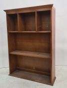 Modern open bookcase, the top shelf pigeonholed, plinth base, 92cm x 124cm