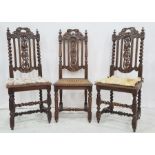 Set of five similar late 19th/early 20th century cane seated chairs in carved oak, pierced frames,