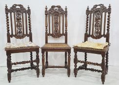 Set of five similar late 19th/early 20th century cane seated chairs in carved oak, pierced frames,