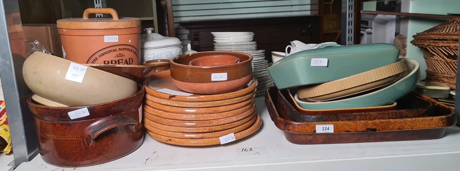 Collection of earthenware plates, casserole dishes, serving dishes, an original Suffolk crock for