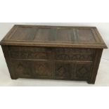 18th century and later blanket chest with four-panelled top, carved front panels and fluted front