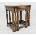 20th century oak nest of three tables on turned and block supports, stretchered base