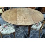 19th century mahogany drop-leaf oval table on cylindrical tapering supports to pad feet, 134cm x