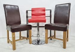 Set of six brown leatherette covered dining chairs and two bar stools in red leatherette and