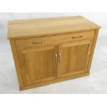 Modern oak desk, the rectangular top with pull-out sliding keyboard drawer, above two cupboard
