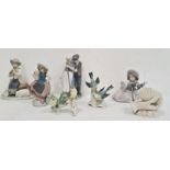 Two various Lladro figures, one with a girl carrying a basket the other seated with a dog, a Nao