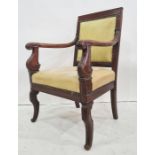 Regency mahogany elbow chair, the square back having stiff leaf carved open scroll arms, cream