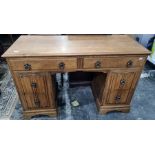 20th century oak desk, the rectangular top with applied moulded edge above six assorted drawers,
