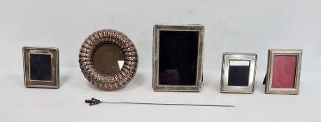 Pair of 20th century miniature silver square-framed picture frames, a circular mounted picture frame