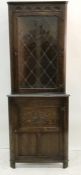 20th century oak corner display unit with leaded glazed doors on base of single cupboard door