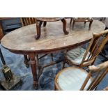 Late 19th/early 20th century oak oval plank-top table on turned and block supports, stretchered