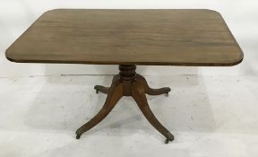 Circa 1820 mahogany breakfast table, the rounded rectangular top with chequered banding and