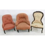 Low Victorian chair in peach ground foliate upholstery and two further chairs (3)