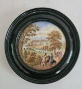 Pot lid mounted in circular black frame, labelled to reverse '188 Strathfieldsaye', decorated with