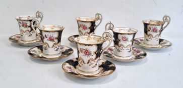 Set of six Coalport cups and saucers, midnight blue and floral decorated with gilt  highlights