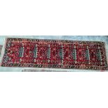 A Turkish runner red ground separate in white blue and yellow with single border; measurements 290/