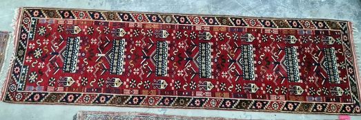 A Turkish runner red ground separate in white blue and yellow with single border; measurements 290/