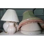 Three cream ceramic table lamps, not matching and four pleated shades of various sizes (7)