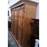 19th century mahogany compactum wardrobe with moulded cornice above three doors, plinth base, two