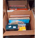 Two boxes of assorted long playing records and various editions of Trivial Pursuit (2 boxes)