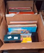 Two boxes of assorted long playing records and various editions of Trivial Pursuit (2 boxes)