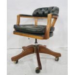 Office swivel Captain's style chair in green leather buttonback upholstery  Condition ReportThis