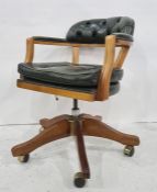 Office swivel Captain's style chair in green leather buttonback upholstery  Condition ReportThis